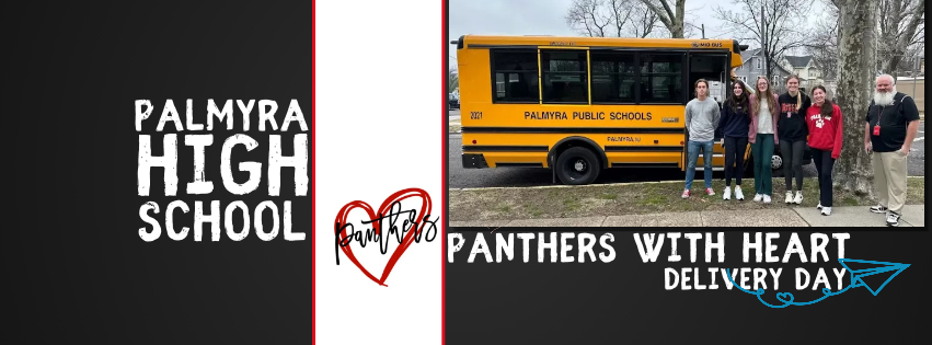 Panthers with heart logo and photo of team leaders outside of district mini bus